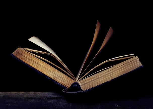 stock-photo-open-book-on-the-black