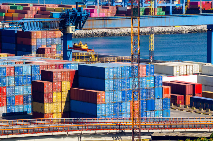 Stacked cargo containers in storage area of freight sea port