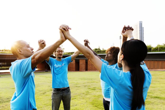 Group of happy and diverse volunteers