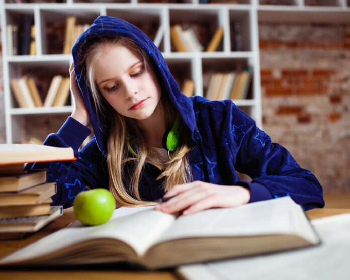Teenage girl in a library